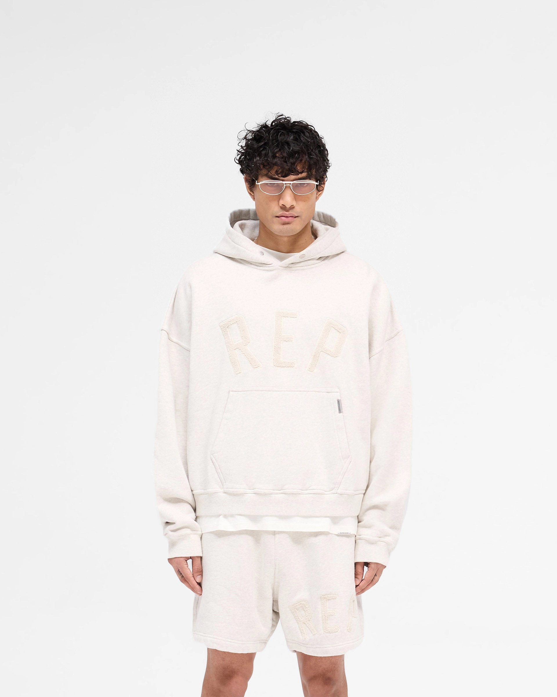 Rep Applique Hoodie - Cream Marl Reinforced Hem Skunk like