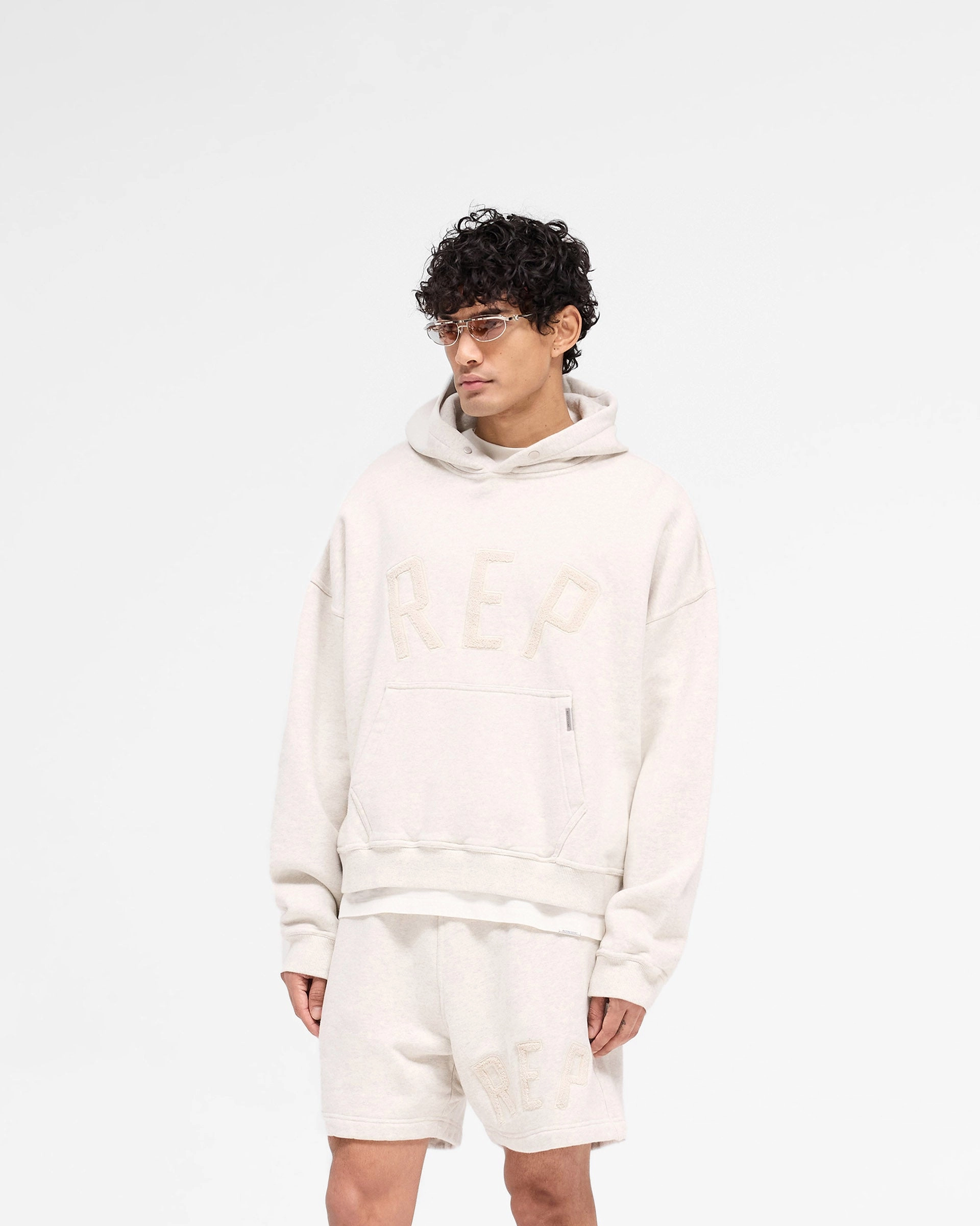 Rep Applique Hoodie - Cream Marl Fashion Energy Rain Resistant