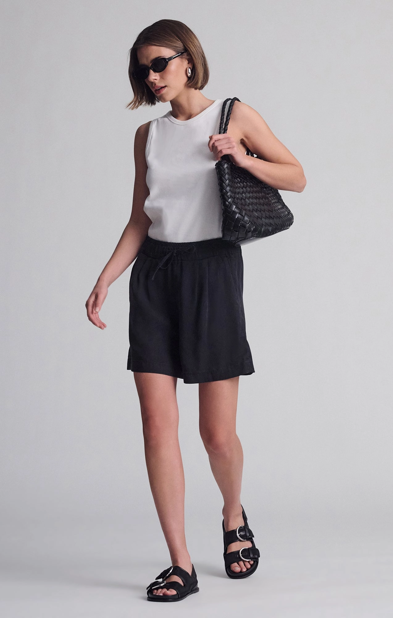 PENNY PLEATED SHORTS IN BLACK USED GOLD denim material embroidery details